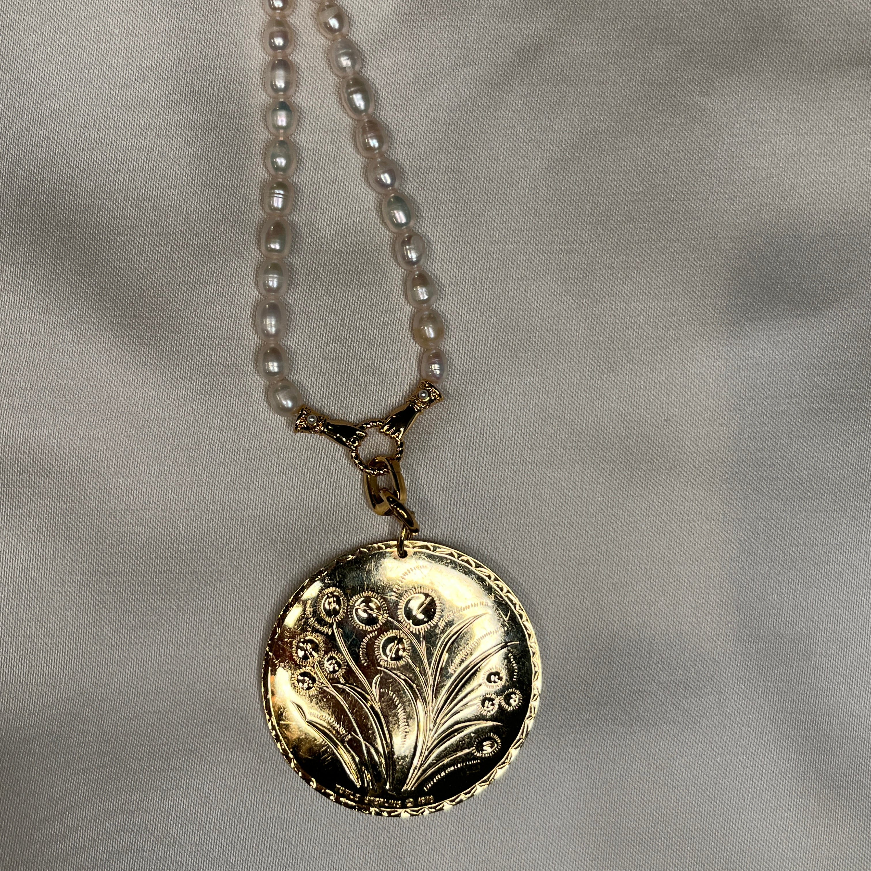 Double sided floral pendant