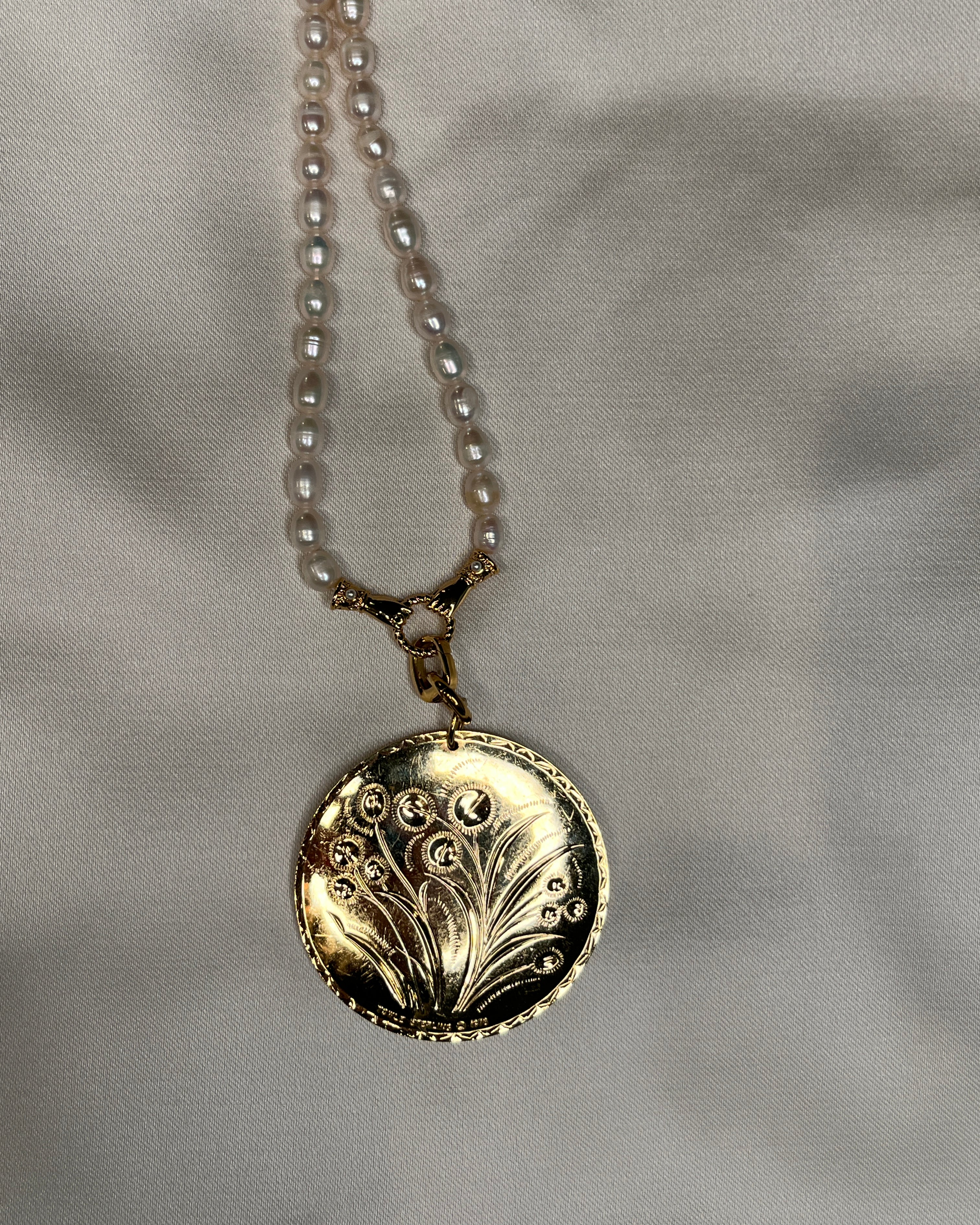 Double sided floral pendant