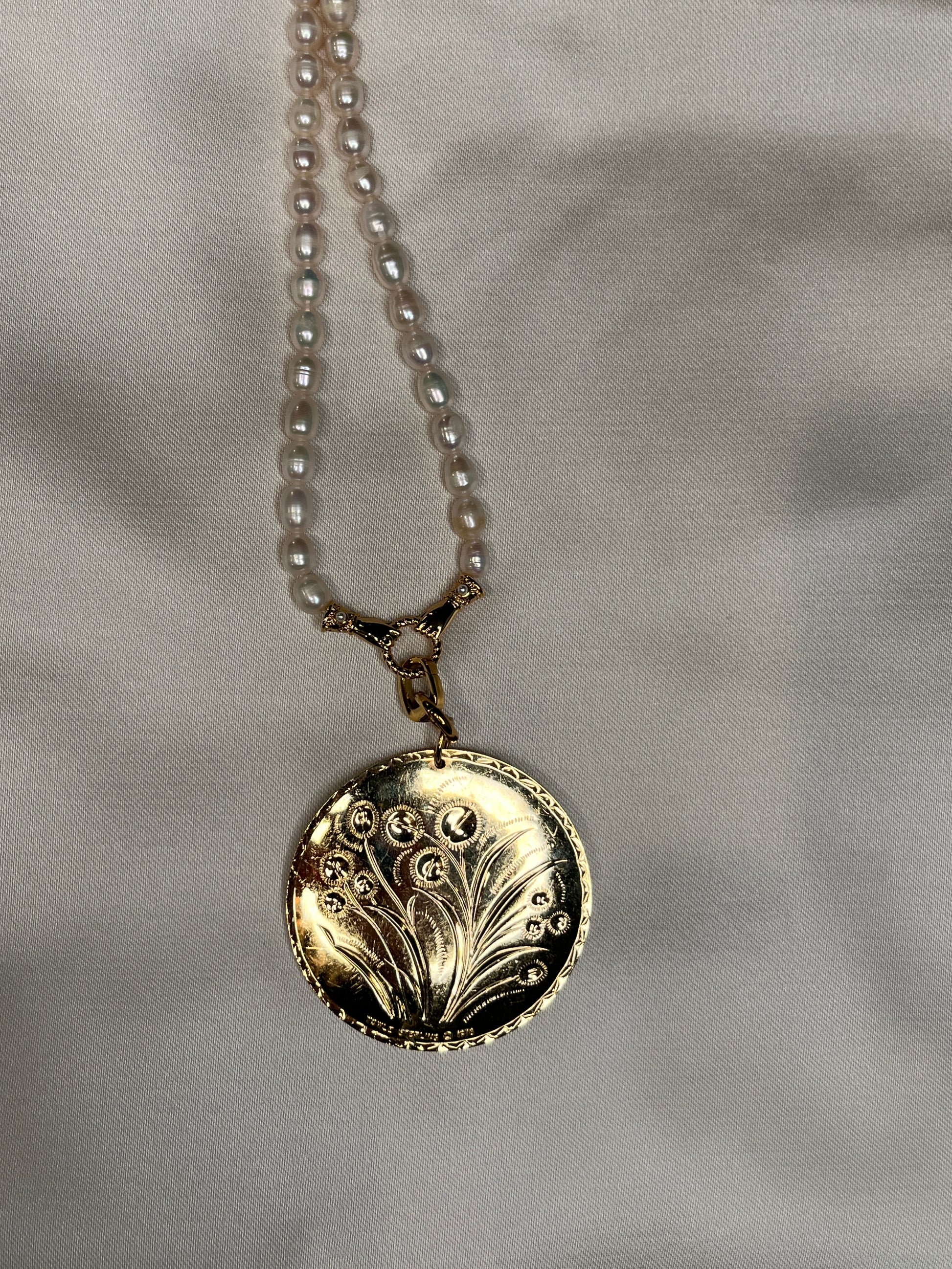 Double sided floral pendant
